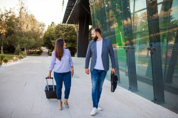 istock Two business colleagues going home after finishing work at the office 1405022428