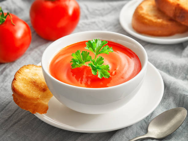 istock Tomato cream soup and toasted bread slices 1405024446