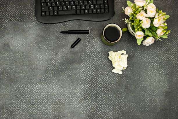 Focus on black leather chair with a office workplace.