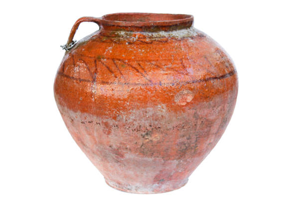 istock Ancient clay brown pot with ornament isolated on white 1405028636