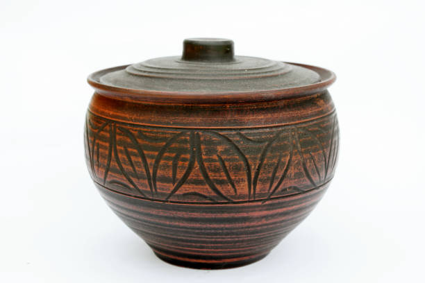 istock Vintage clay pot with lid on white background 1405029603