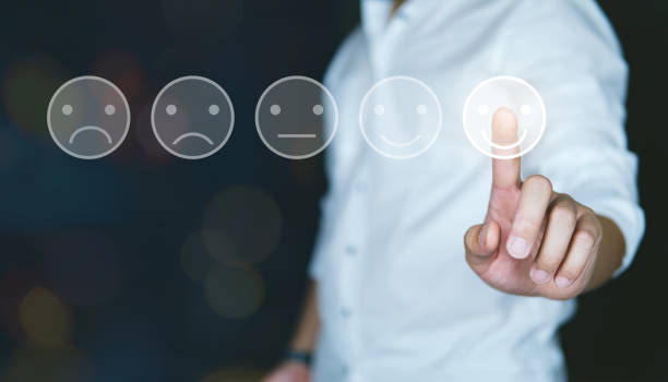 istock Customer review good rating concept, people pressing smile face icon level review on visual screen for positive customer feedback, testimonial and testimony. 1405033232