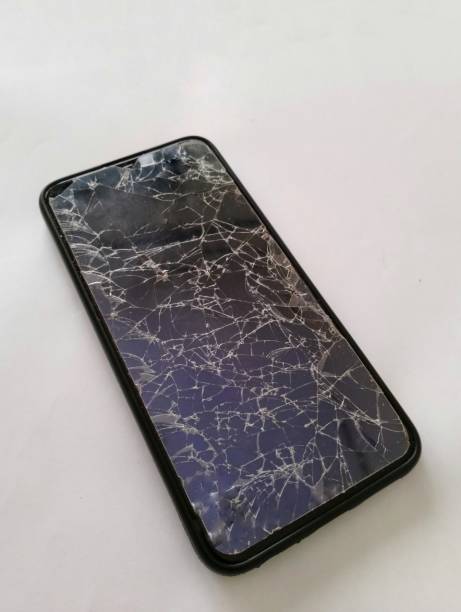 istock Top view of broken phone screen on white background 1405034416