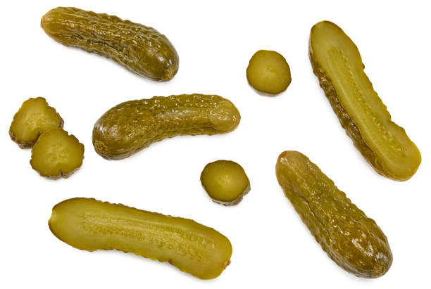 istock marinated pickled cucumbers with slices isolated on white background. Clipping path and full depth of field. Top view 1405035703