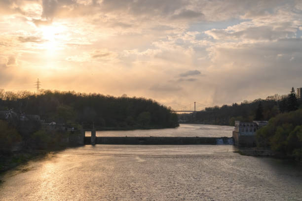 istock Dam on the river with building and bridge on the background 1405037160