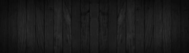 istock old black grey rustic dark wooden texture - wood background banner panorama 1405039454