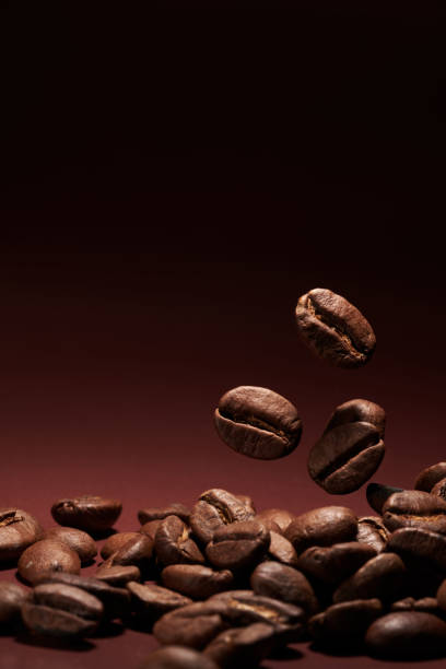 istock Roasted coffee beans closeup on brown gradient background 1405039479