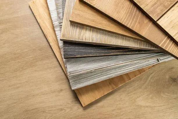 Stack of various construction sample wood boards.