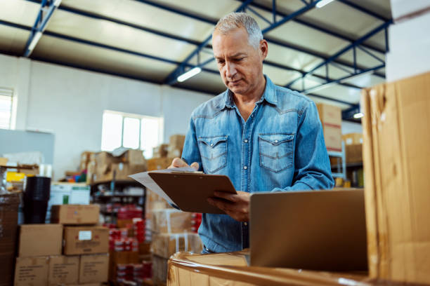 istock Male warehouse checking stock 1405039816