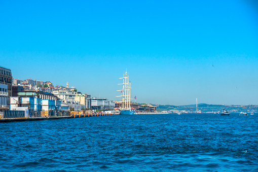 Istanbul, Turkey, May 21, 2022: Galataport, huge sailing ship can be seen on the right side. Galataport is a cruise ship port and mixed-use property in Karakoy district.