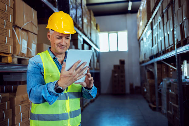istock Male warehouse working at distribution warehouse. 1405040794