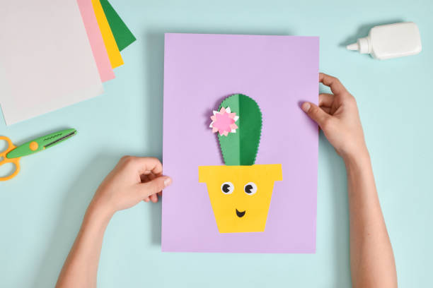 istock DIY. A postcard with a cactus in a pot. Step-by-step photo instruction. 1405040848