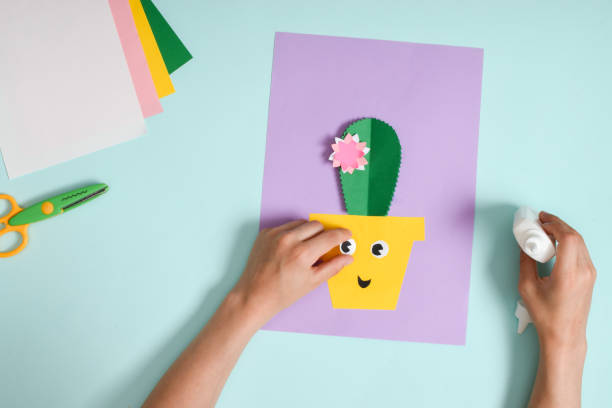 istock DIY. A postcard with a cactus in a pot. Step-by-step photo instruction. 1405040849