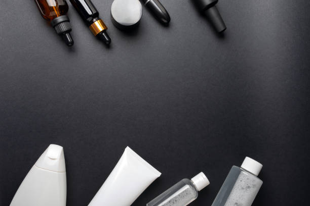 istock template from a set of white and black cosmetics on a black background 1405040949