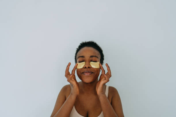 istock Young woman applying under-eye patches 1405042050