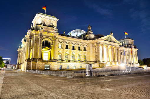 The Reichstag building seen from the former Königsplatz at sunset in Berlin, Germany