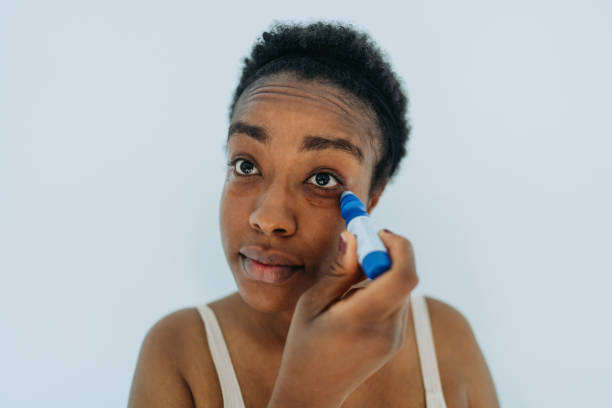 istock Relaxing facial massage with an under-eye roller 1405042137