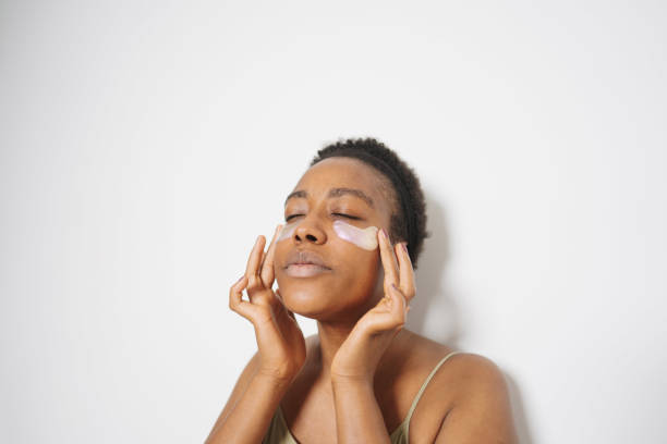 istock Young woman applying under-eye patches 1405042295