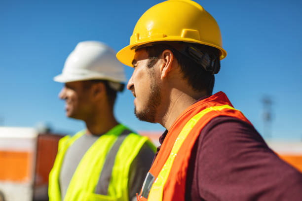 istock Black and Hispanic Male Construction Workers on Work Site Wearing PPE Evaluating and Discussing Projects Infrastructure Photo Series 1405043462