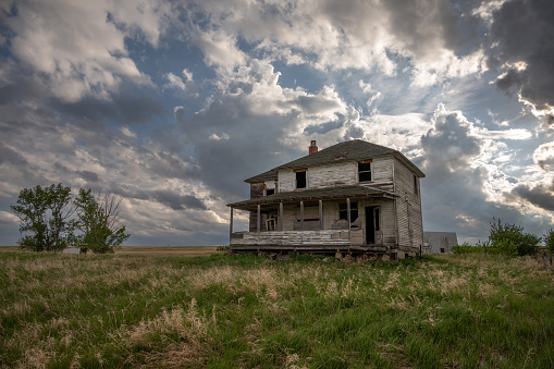 Facade of an old farm house on the prairies of Alberta, Canada.