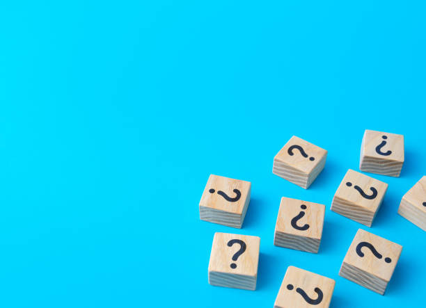 istock Scattered blocks with a question mark. Lots of unknown facts. Analytics and analysis of information. Curiosity, exploration. Induction, deduction. Confusing business. Questions and problem solving. 1405049160