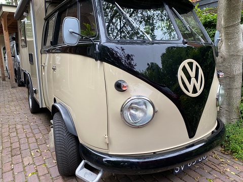 Santpoort, Netherlands - June 24, 2022.  Retro VW camper, parked in the city street.