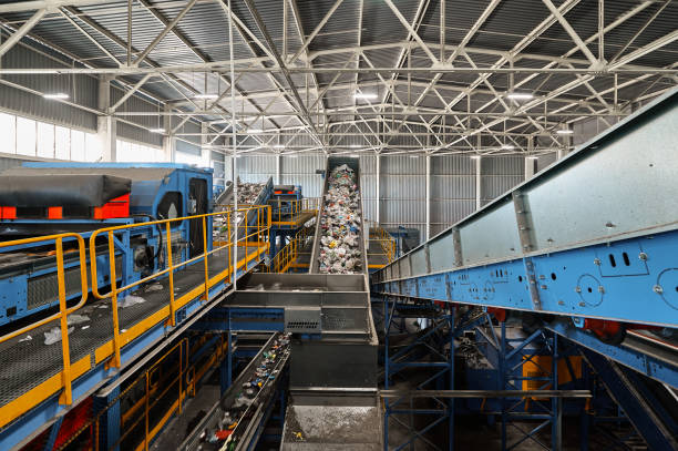 istock Trash transported by conveyor in recycling plant workshop 1405051814