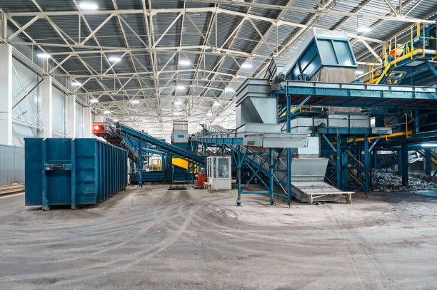istock Large production line with conveyors carrying trash at plant 1405051862