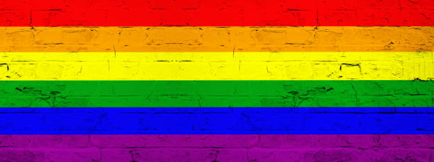 istock LGBT Background - Brick wall painted with rainbow flag - wood texture 1405055171