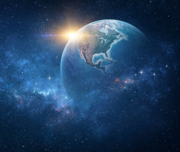 istock Sun rising over Planet Earth in outer space 1405055297