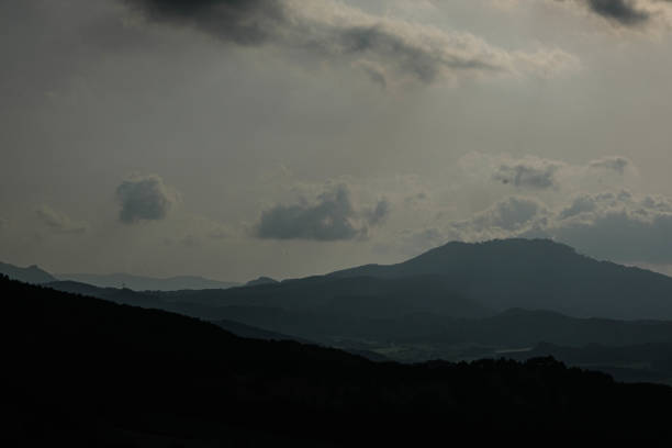 istock foggy mountain silhouette in the evening 1405055385