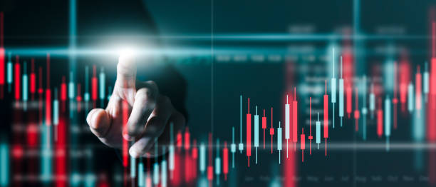 istock Businessman Trader at work technical price chart and red and green candlestick chart indicator and computer screen background for stock trading. 1405055691