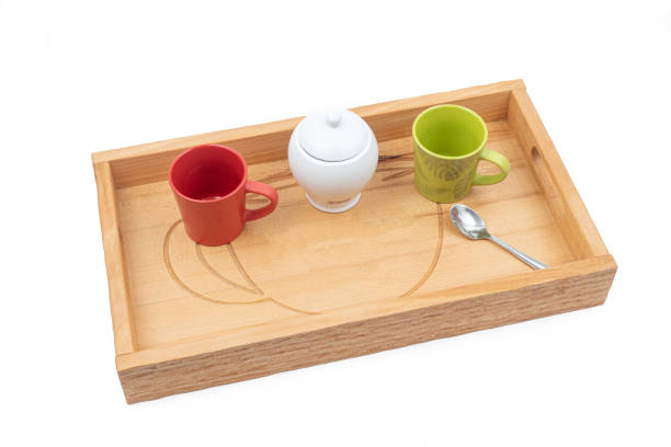 Wooden tray for coffee cups isolated above white background.