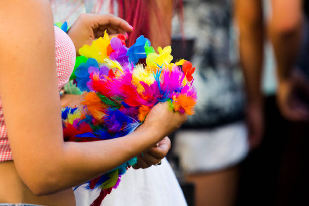 istock Close up on woman holding colorful feathers 1405056490