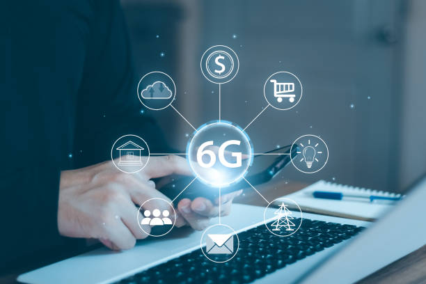 istock Young man hand holding a phone with a 6G hologram. 1405057867