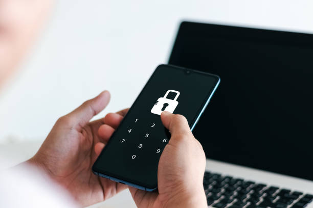 istock Hacking a Phishing mobile phone with a password to access a smartphone. 1405057899