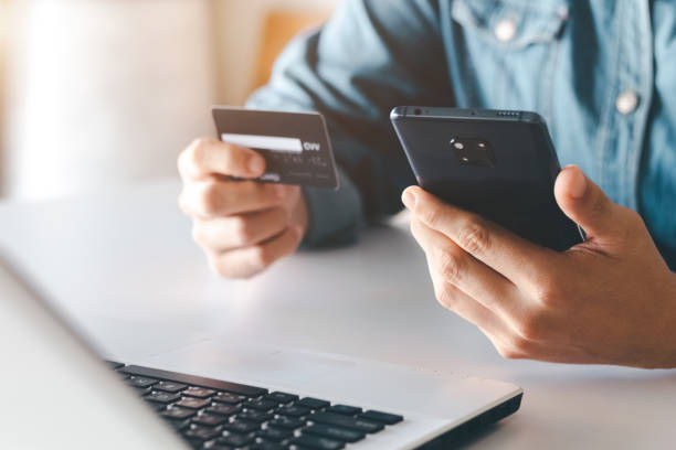 istock Businessman using smartphone paying and shopping with smartphone application. 1405058066