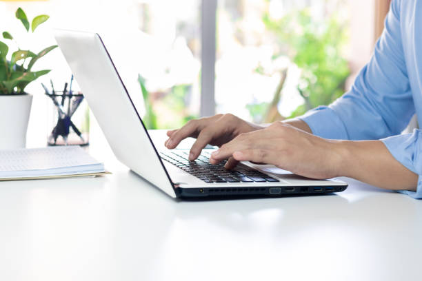 istock The hand of the office manager uses a laptop keyboard while working. 1405058225
