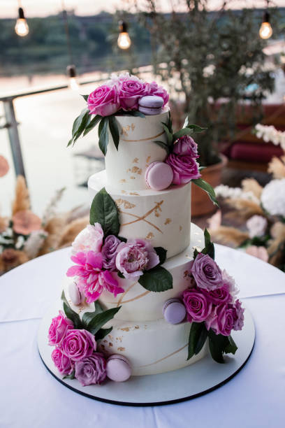 istock large beautiful wedding cake in the evening near the arch with decor 1405058905