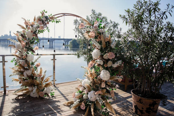 large beautiful wedding arch on the lakeside ceremony