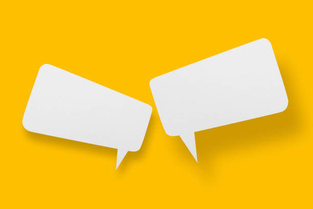 istock White paper in speech bubble shape set against yellow background. 1405059773