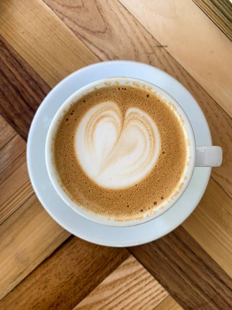 istock A cup of coffee latte on a wooden table 1405065294