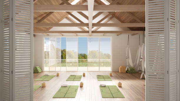 istock White folding door opening on empty yoga studio interior design, minimal open space with mats and accessories, wooden roof, ready for yoga practice, panoramic window, summer panorama 1405066745