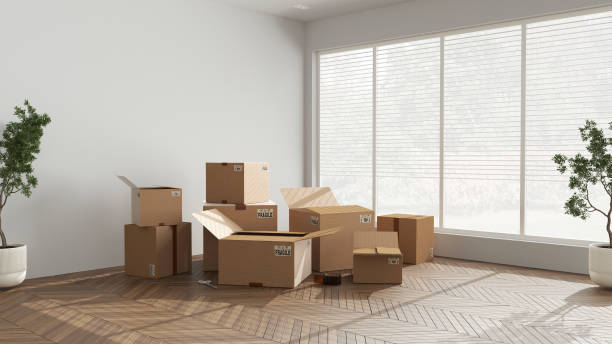 istock Cardboard carton boxes stack in modern empty room, wooden step ladder, interior design. Panoramic window and parquet floor, potted plants. Moving concept idea 1405066868