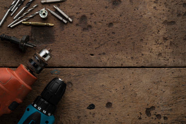 istock Close up electric drill and electric screwdriver with drill bit 1405069467