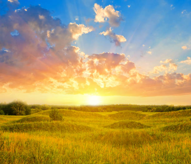 istock wide summer prairie wit hills at the dramatic sunset 1405077475