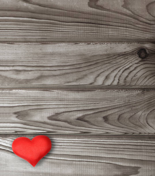 istock red heart on dark wooden planks 1405078116