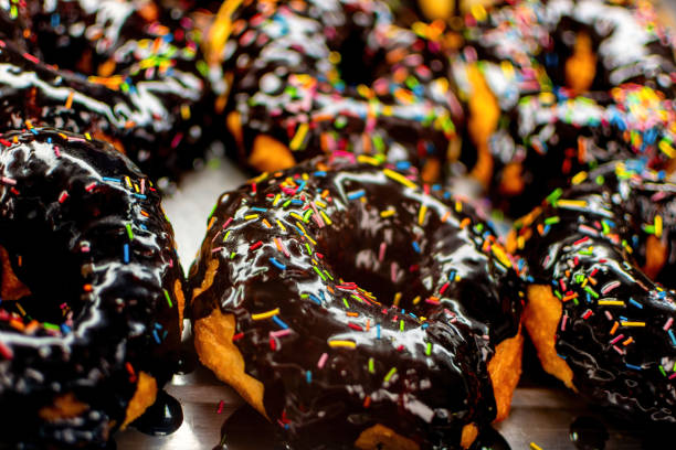 istock Donut with Sprinkles in bakery window closeup 1405089626