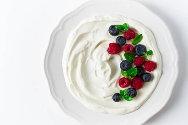 istock Breakfast, yogurt with fresh berries, raspberries and blueberries, on a white background, selective focus, no people, healthy food, 1405093371
