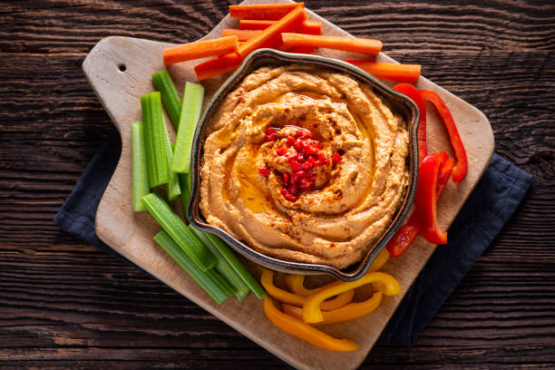 Roasted Red Pepper Hummus Roasted Red Pepper Hummus with Fresh Vegetables hummus stock pictures, royalty-free photos & images